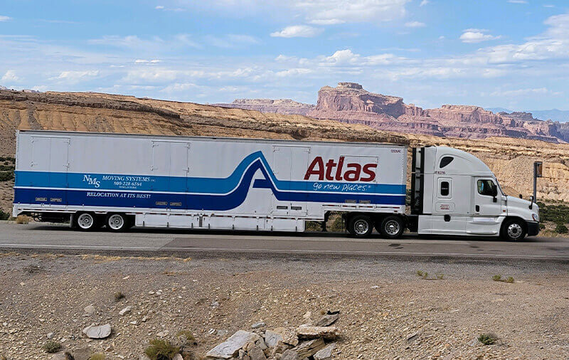 An NMS Moving Systems truck on the road